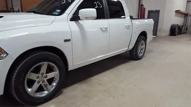 The same Ram finished in colour matched white, panels back on and gloss even across the door seam